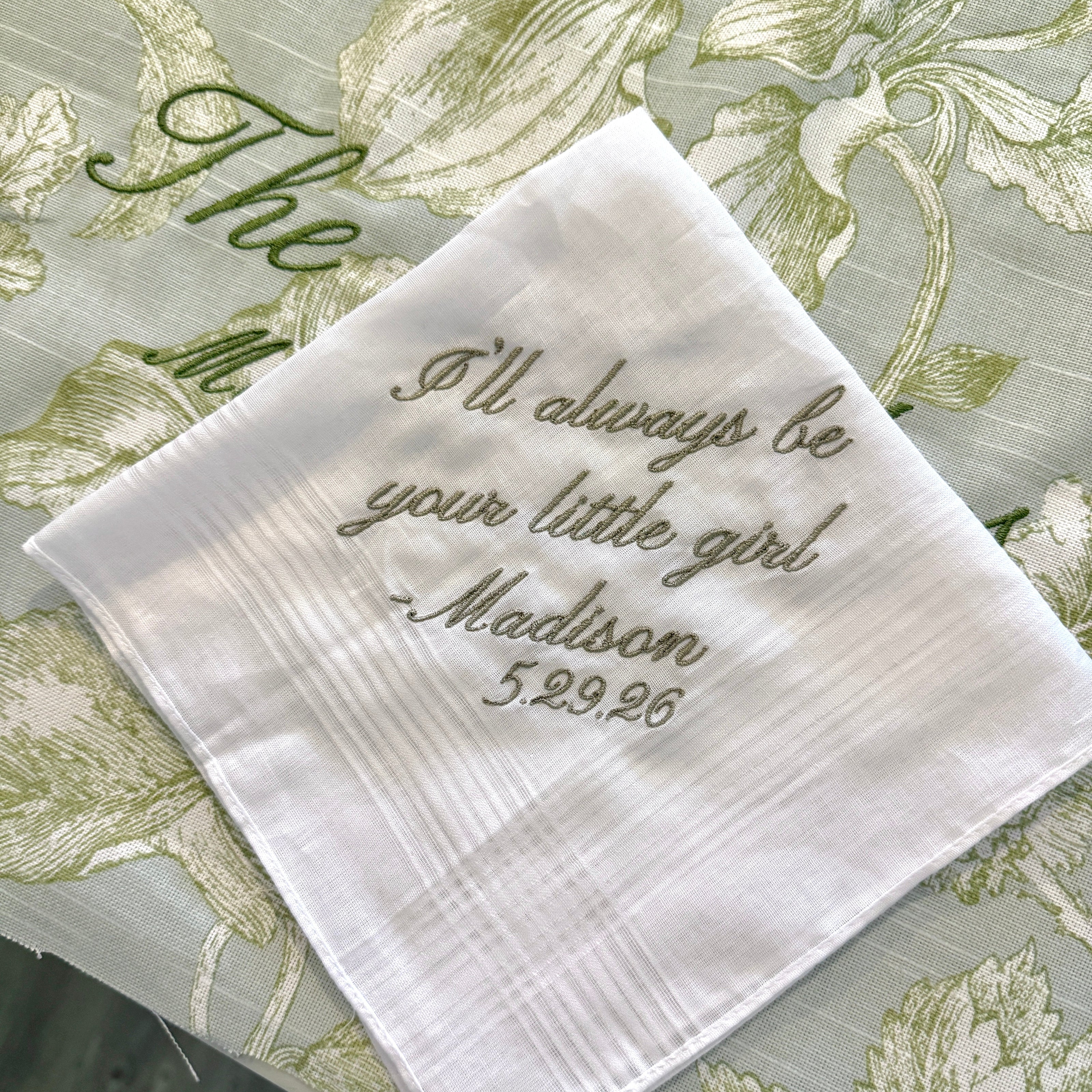Personalized embroidered handkerchief featuring a custom message and date, created as a meaningful keepsake gift for a wedding or special occasion.